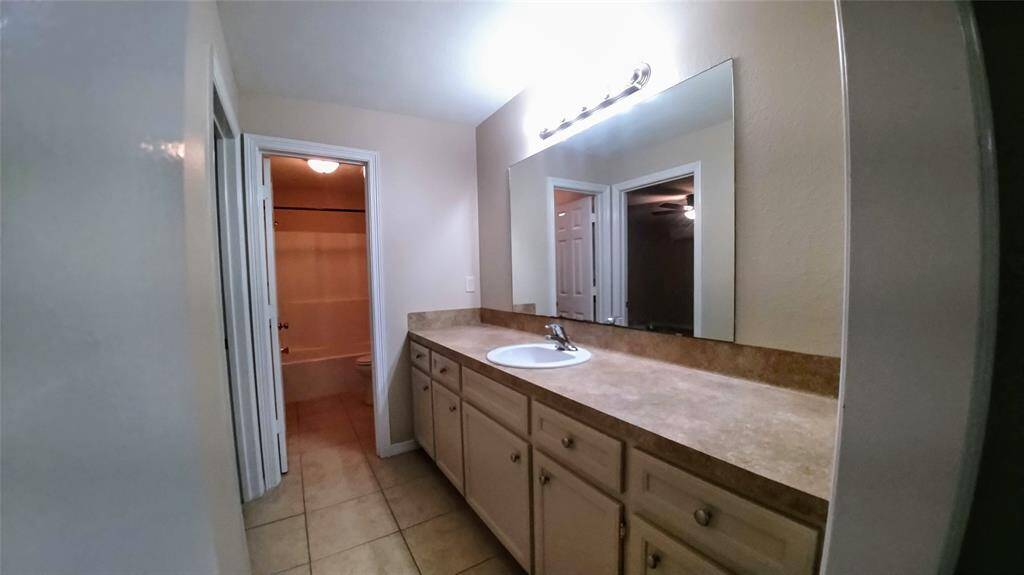 Transform your morning routine with our spacious vanity mirror and counter, complete with 4 drawers and 5 cabinets.  Perfectly situated next to the second bedroom and full bath for ultimate convenience.