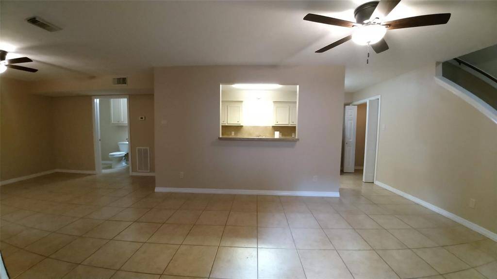 Step into this cozy space and take in the view of the open concept - featuring a spacious living room, convenient half bath, well equipped kitchen with pass-through meal bar, handy washer/dryer closet, inviting dining area, and a staircase leading up to the bedrooms.