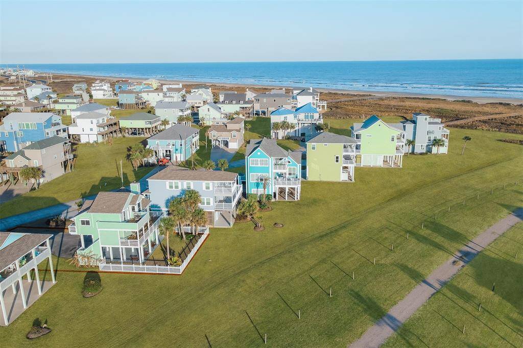 Birds-eye view. The house stands out as it's the only fenced house on the street.