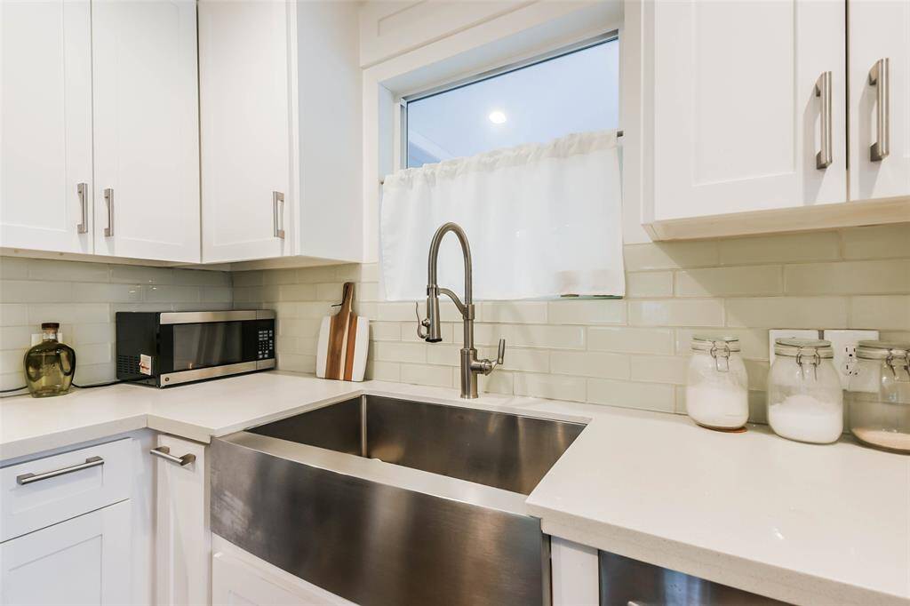 Custom cabinets and farmer's sink.  Window overlooks the backyard.