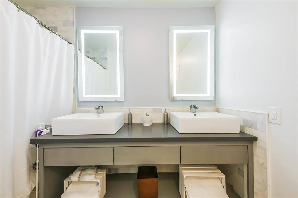 Marble tile in restrooms and lighted mirrors.