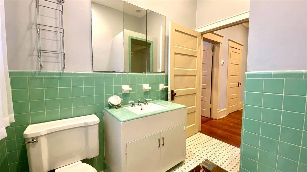 Original bath still has it's original tile and fixtures