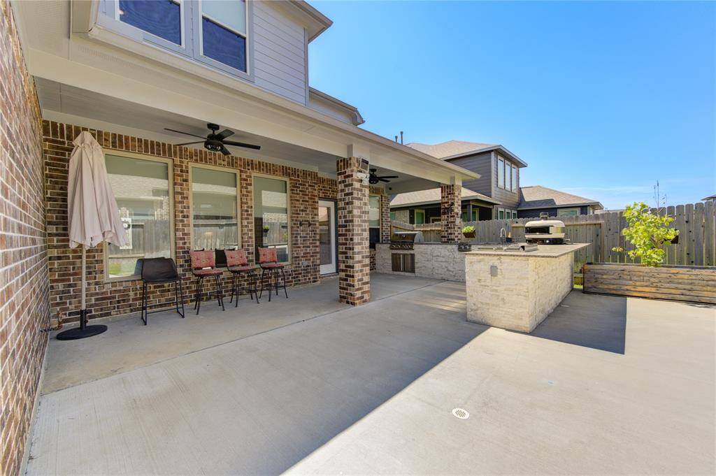Amazing outdoor kitchen/patio—plenty of room to dance the night away!