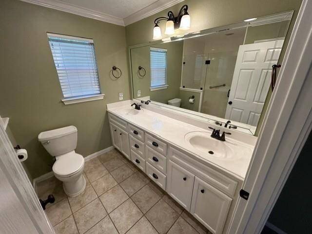 PRIMARY BATH FEATURING DOUBLE SINKS AND LARGE WALKIN SHOWER