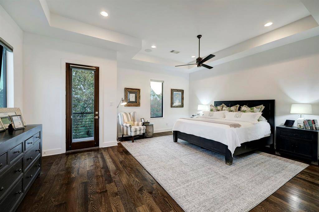 Second floor library/study is ideal for a home office, has a private balcony. Hardwood flooring, shelving and lower cabinets for storage.