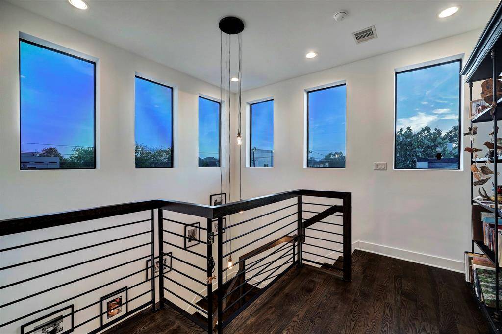 Staircase view to third level of home.