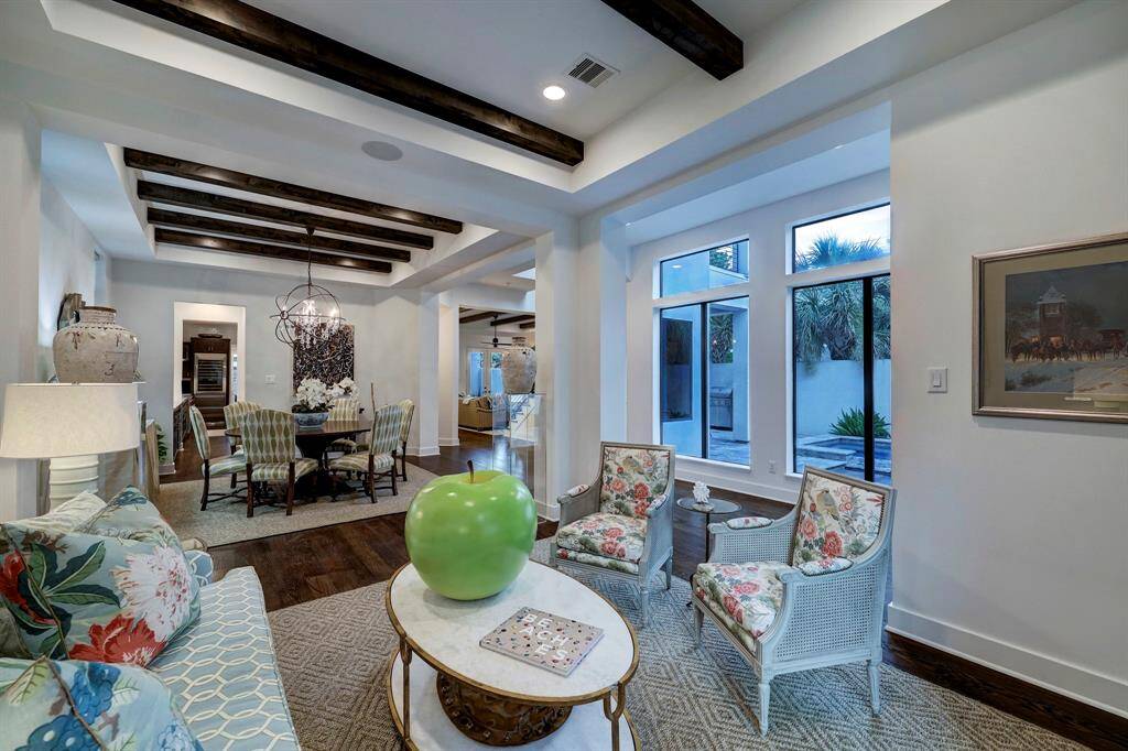 Open floor plan with so many details, this is a view of the sitting room upon entry, open to dining area.