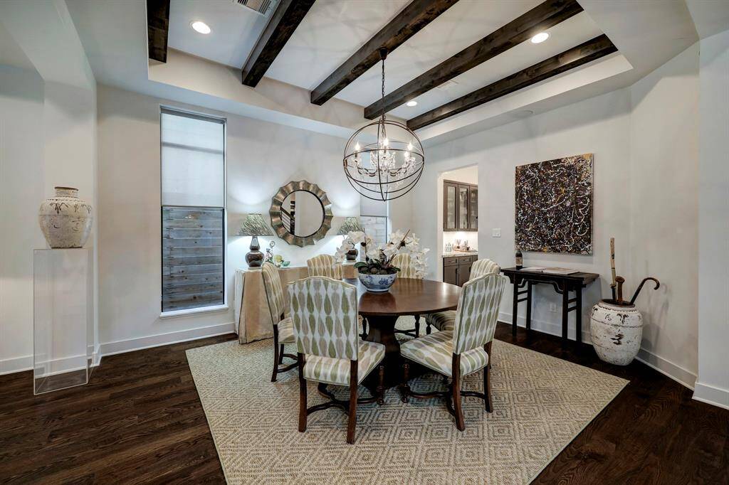 View of sitting room to dining room space-all overlooking pool and patio area. Shows beautifully!