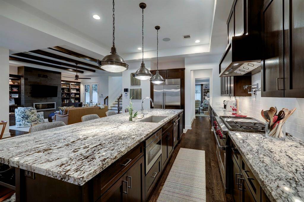 Outstanding kitchen with commercial grade stainless appliances. Wolf 48" duel fuel gas range with six burners, griddle, double oven, vent hood and pot filler. Asko bar handle dishwasher, SubZero side by side refrigerator/freezer. SubZero wine refirgerator which olds 77 bottles and two beverage drawers below.