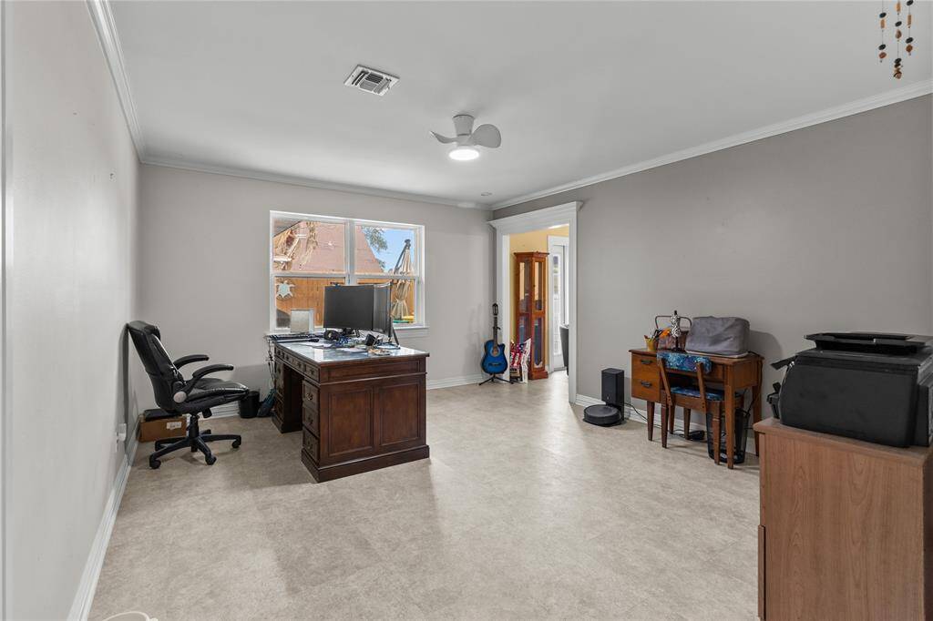 Formal dining room has a built in hutch and large windows with views of back yard.