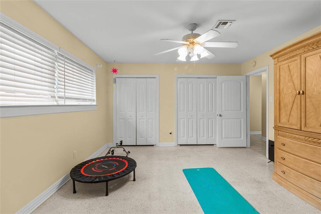 Middle bedroom has terrazzo flooring, large closets and storm windows