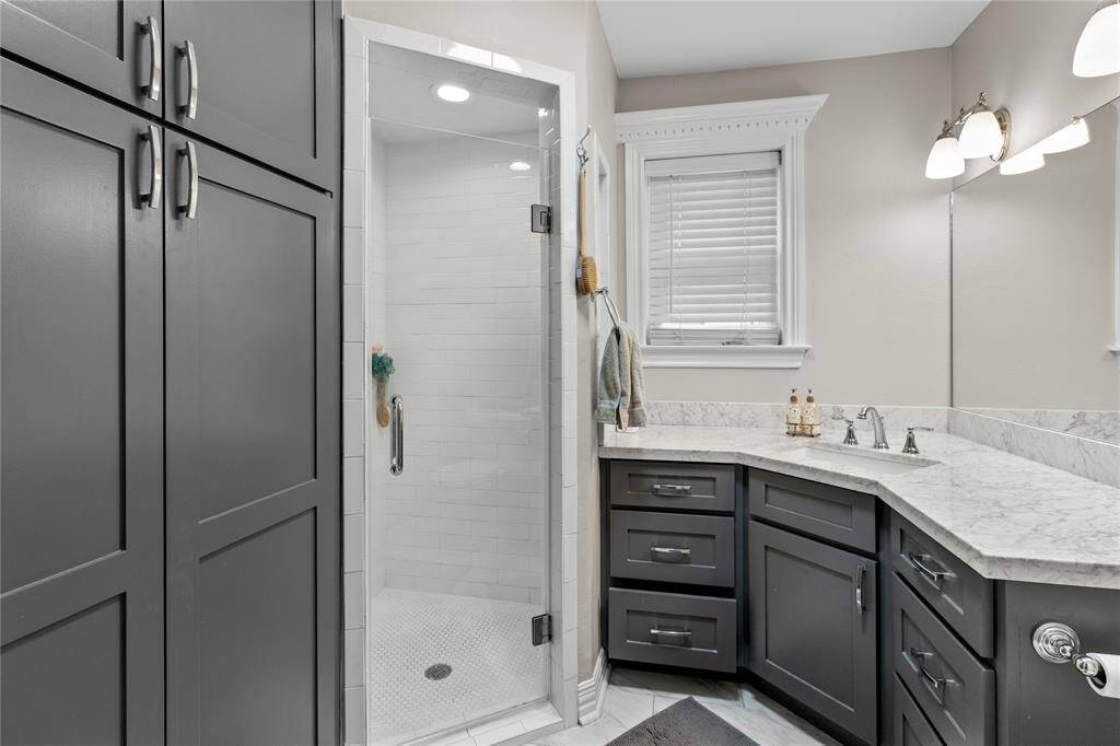 Remodeled primary bath in 2020, custom cabinetry spacious shower and lots of natural light.
