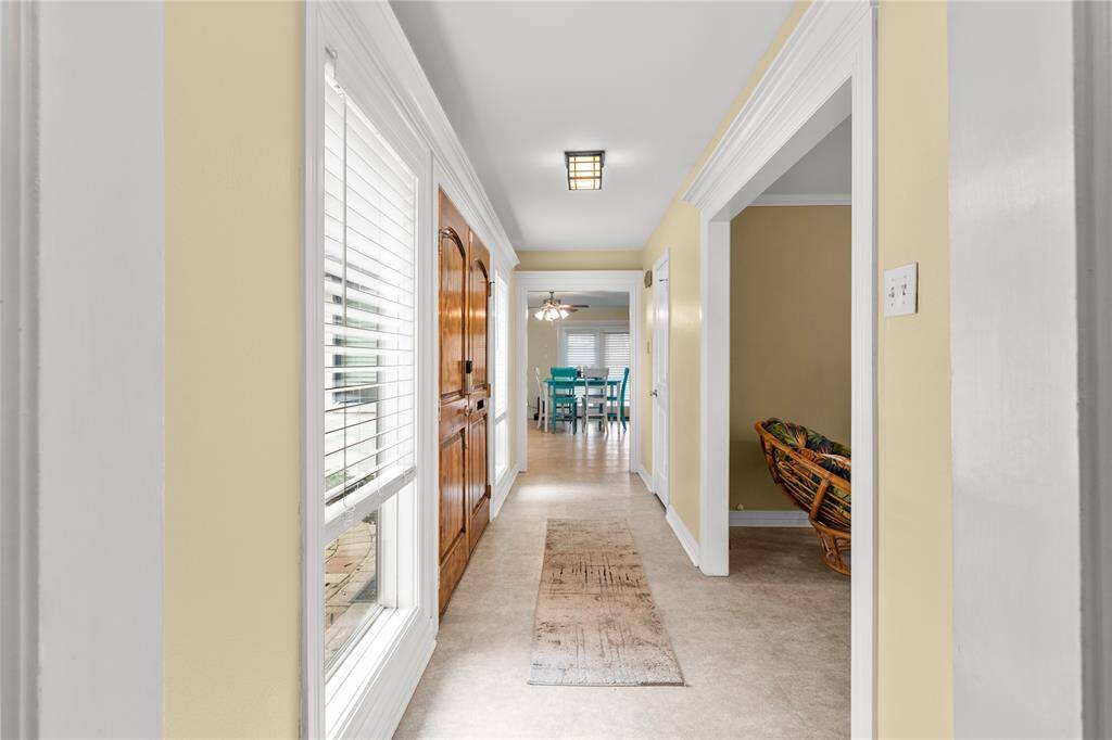 Foyer and views of living room and family room