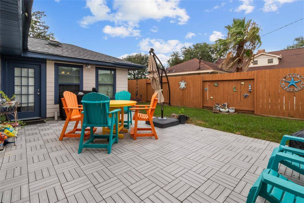 Tiled section covering a concrete slab provides enormous space for outdoor patio furniture/hot tub/gazebo. Plenty of running space for a family pet.
