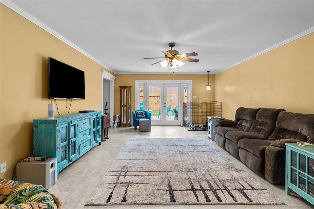 Formal living room with French door access to back patio.