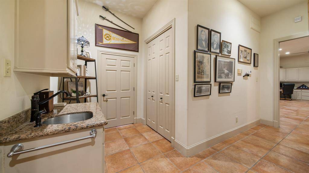 This mudroom area of the home that offers closet space, utility room, and storage room.