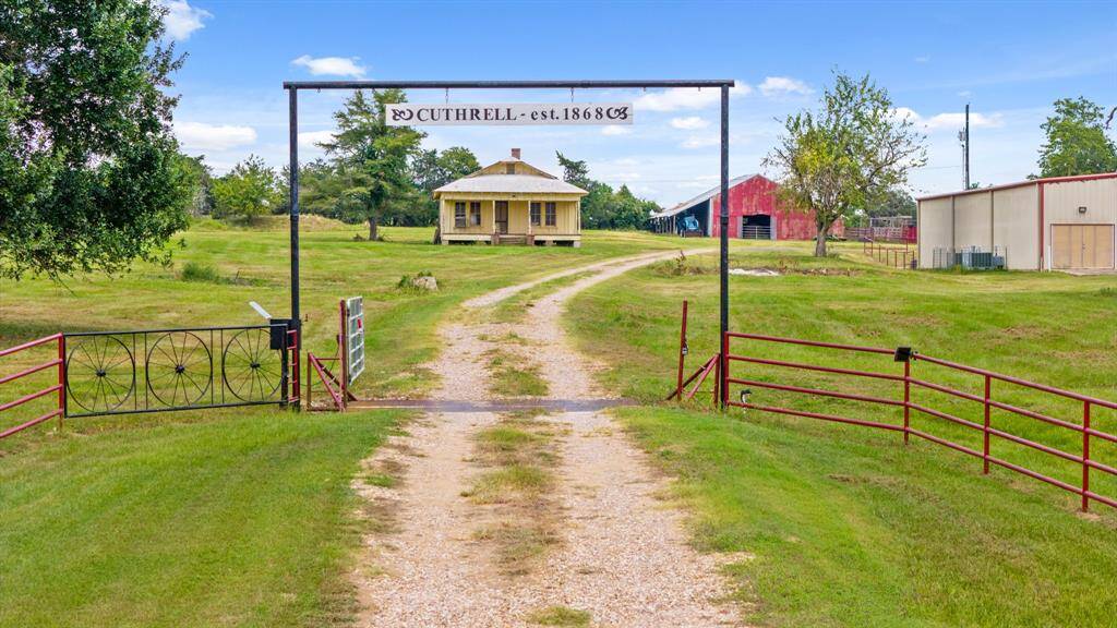 Family Homestead established in 1868. Electric gate with cattle guard with a driveway and old home that