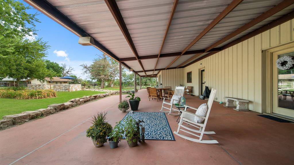 Extended porch area with 12ft high pitched roof and 22 ft of extended concrete.
