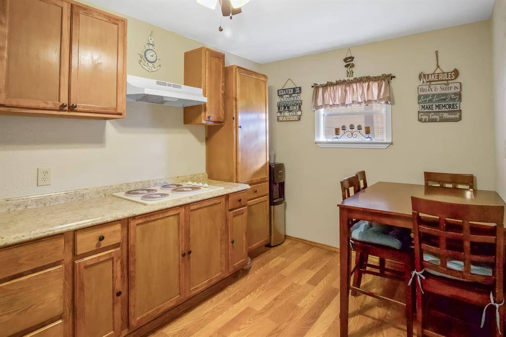 Delight in this inviting kitchen, featuring sleek appliances and room for a comfortable dining area.