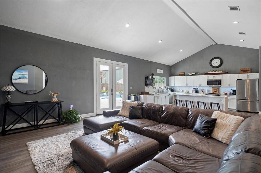 Large family room that opens right up to the pool and kitchen.