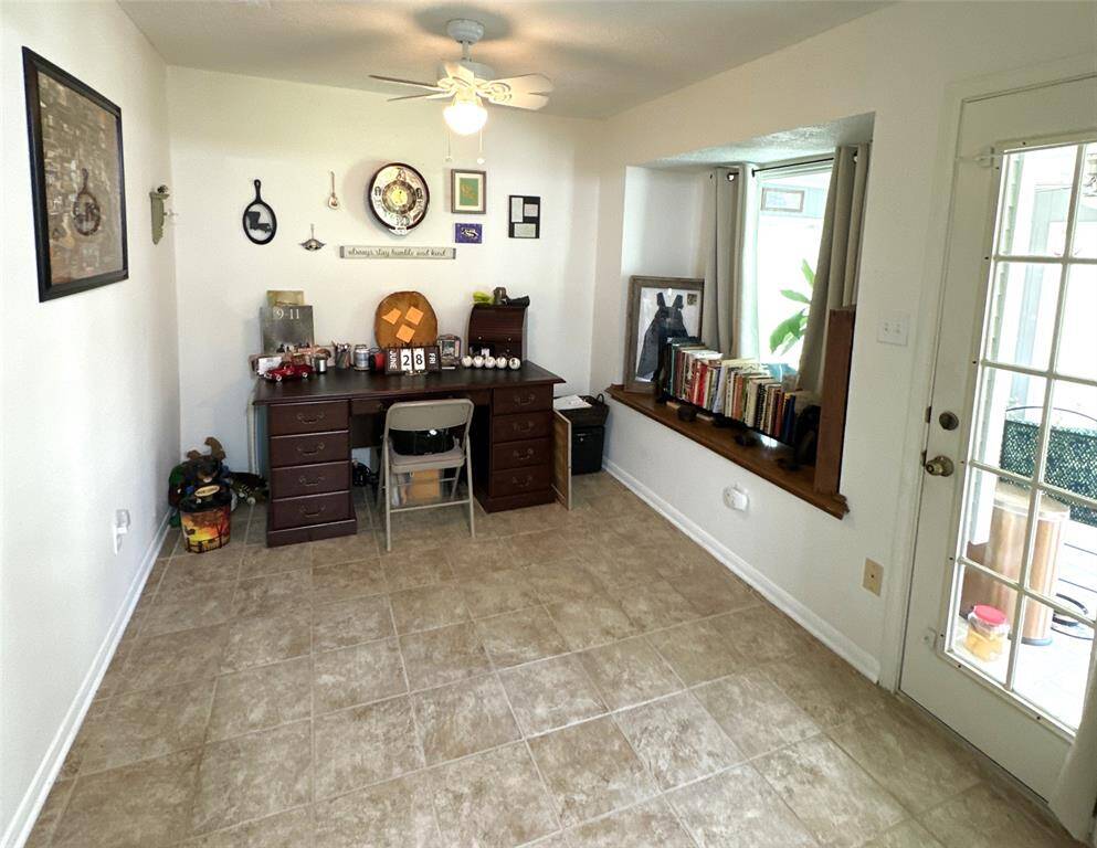 Step into the home from the converted garage and enter this cozy space featuring a charming bay window. The adjoining sunroom is bathed in natural light, perfect for relaxing on sunny days.