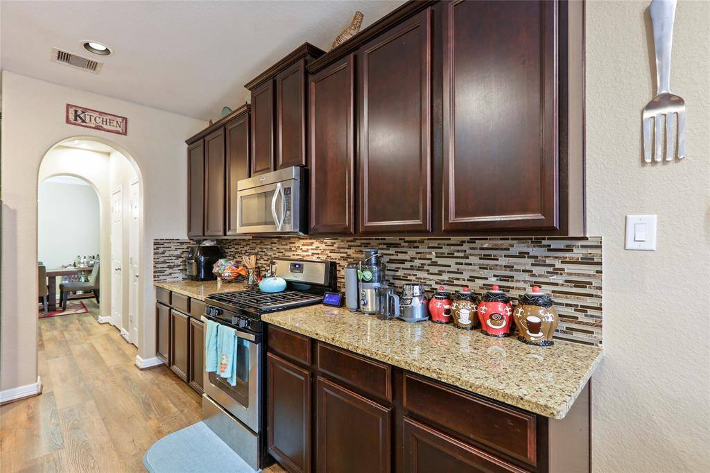 Beautiful architectural arch way leading to formal dining area.
