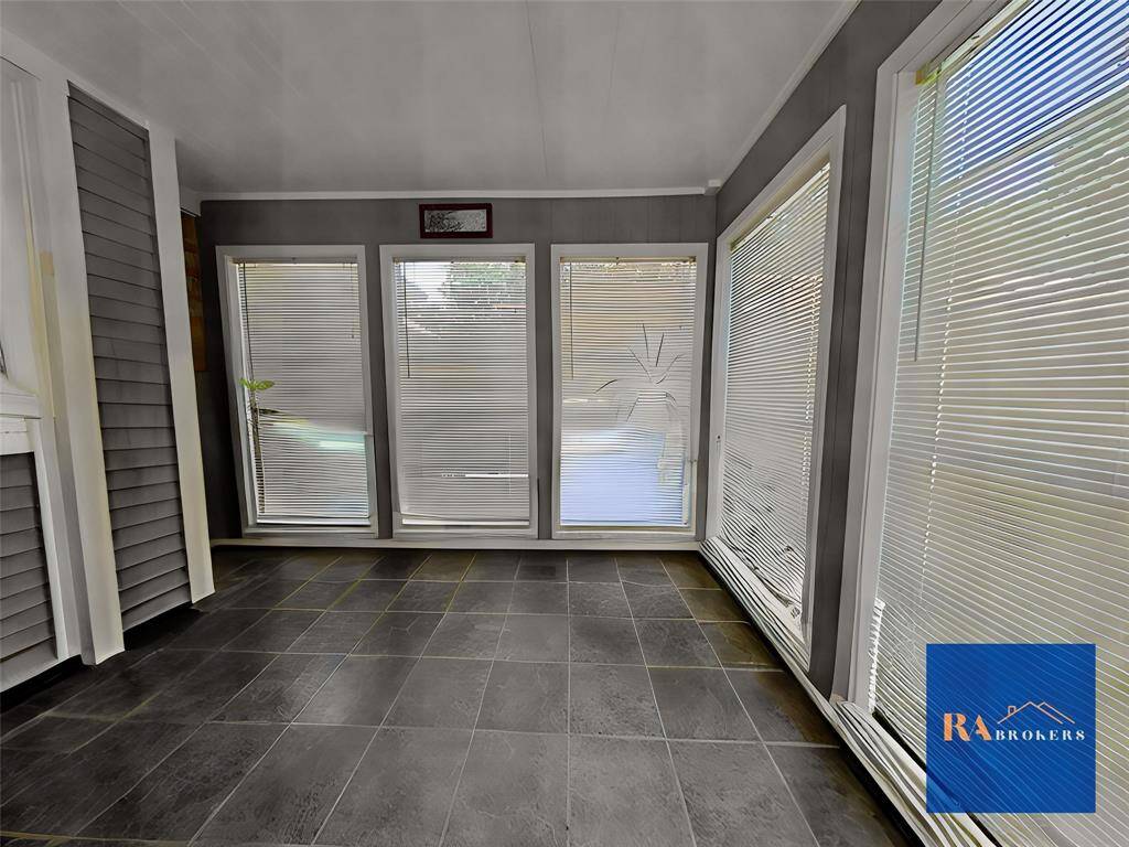 View from the front of the home! The french doors take you into the converted garage space that can be used in so many different ways.
