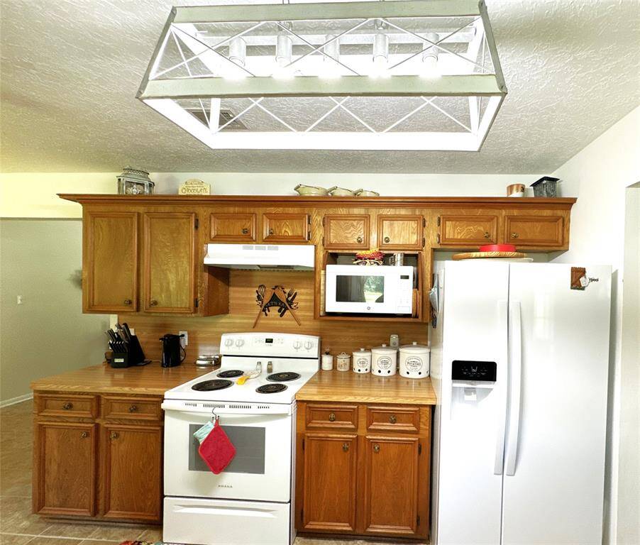 Modern kitchen with included refrigerator.