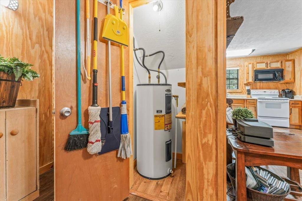 Cleaning closet and water heater on first floor.