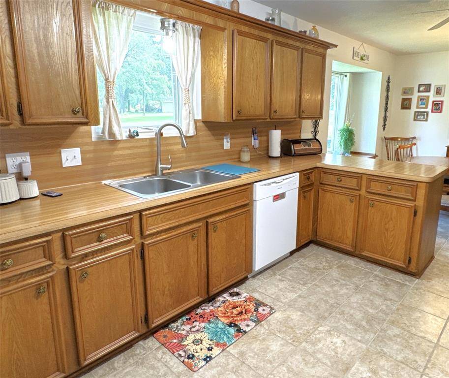 Charming kitchen with a convenient breakfast bar.
