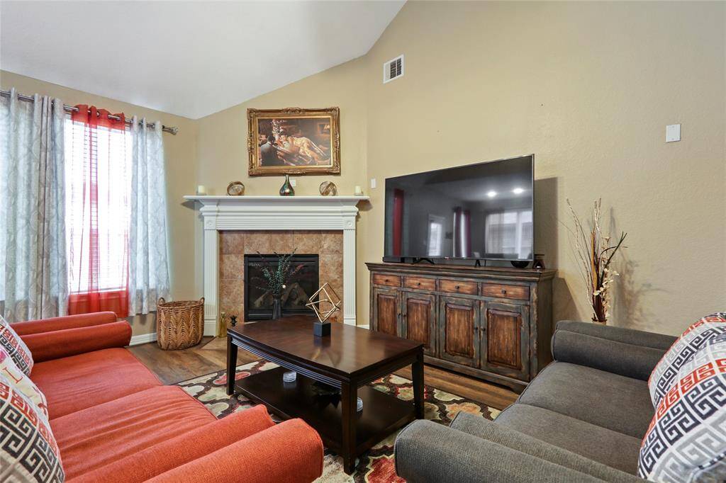 Fireplace with gas connections and wood-burning.