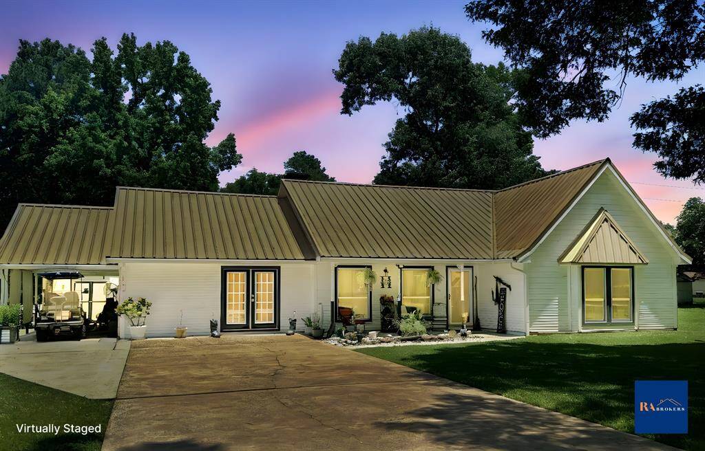View from the front of the home! The french doors take you into the converted garage space that can be used in so many different ways.