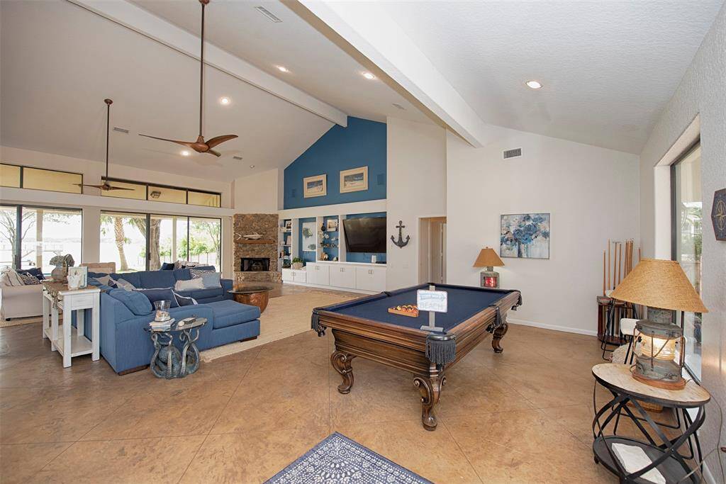 Entry to the home is an amazing entertainment area with pool table for evening fun.
