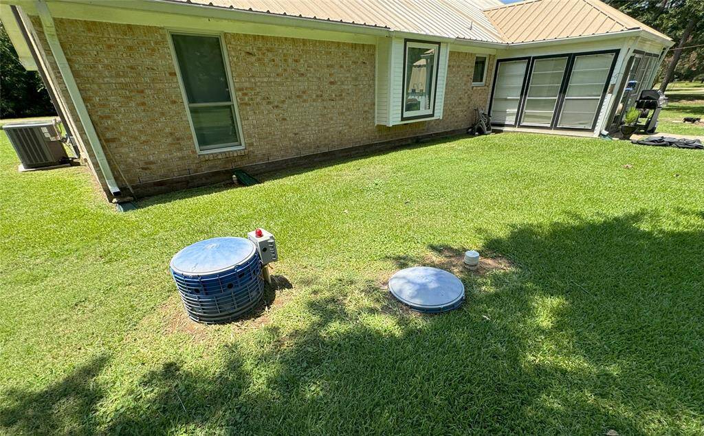 Backyard equipped with a convenient septic system.