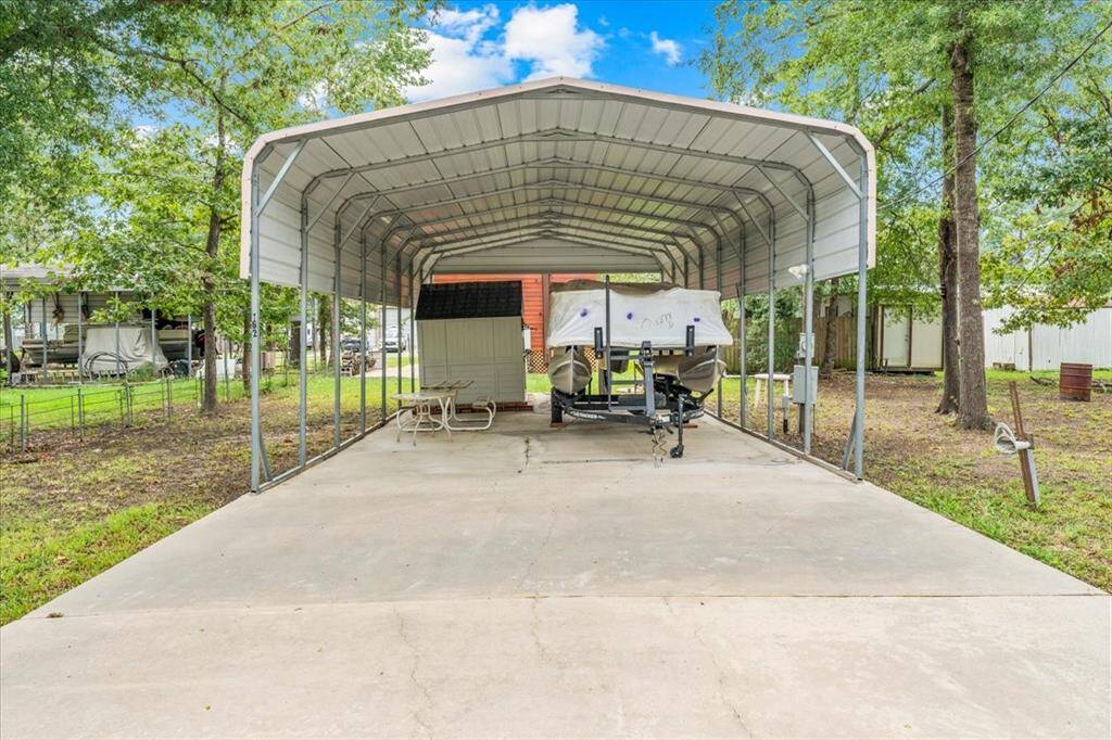 Covered area for all your weekend toys or an RV.