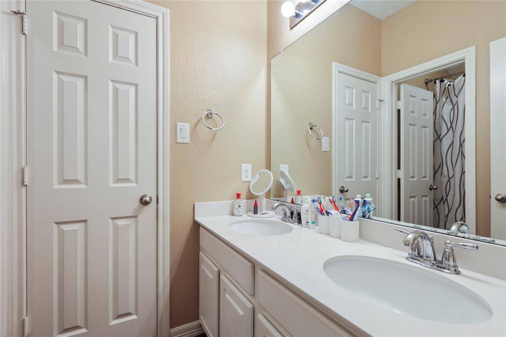 Bathroom with double sinks and ample amount of counter space.