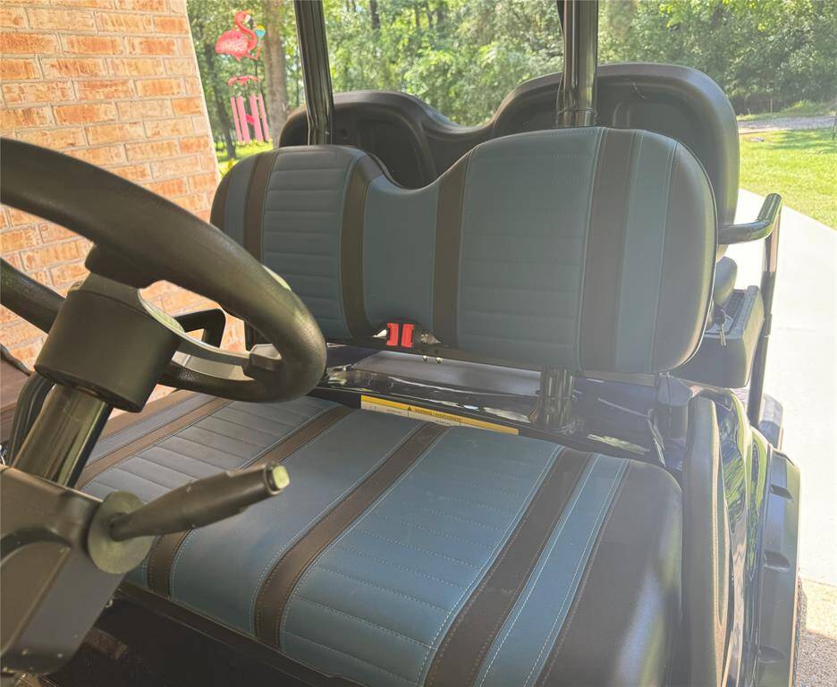 Comfortable seating in the golf cart adds convenience for exploring the property.