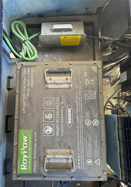 Efficient lithium-ion battery installed in golf cart for enhanced performance and longevity.