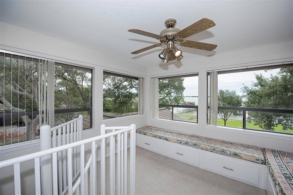 There is a spiral staircase to a third level with a bird's nest with spectacular 360 views of the lake.