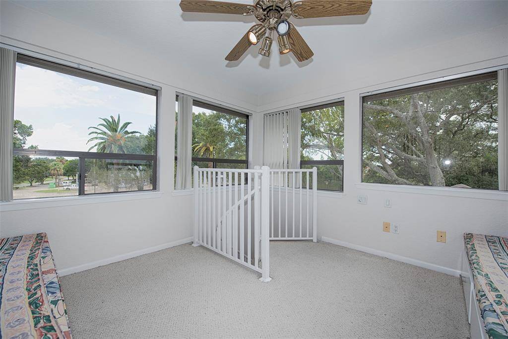 Another view of the bird's nest upstairs with 4 walls of windows also facing the front to the home.