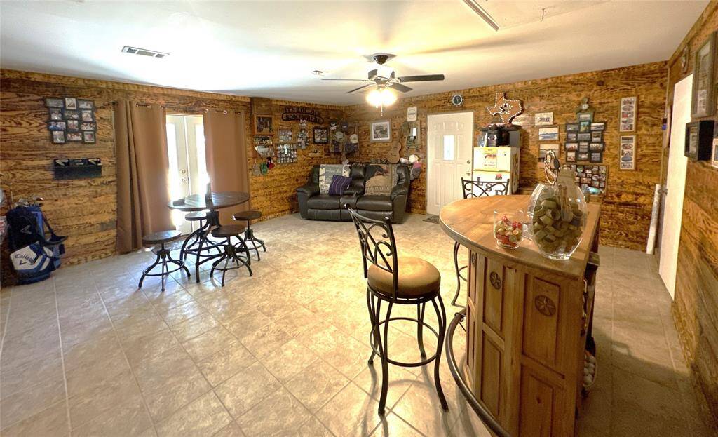 This versatile converted garage is perfect for a cozy retreat or an entertaining game room!