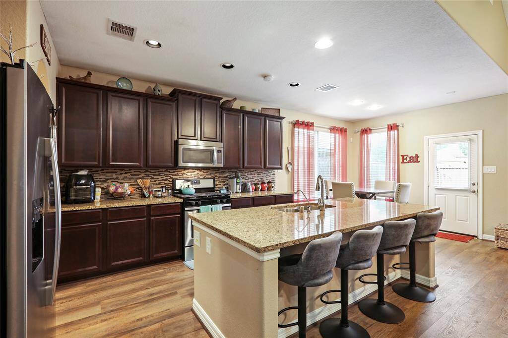Modern kitchen with dark brown cabinets.