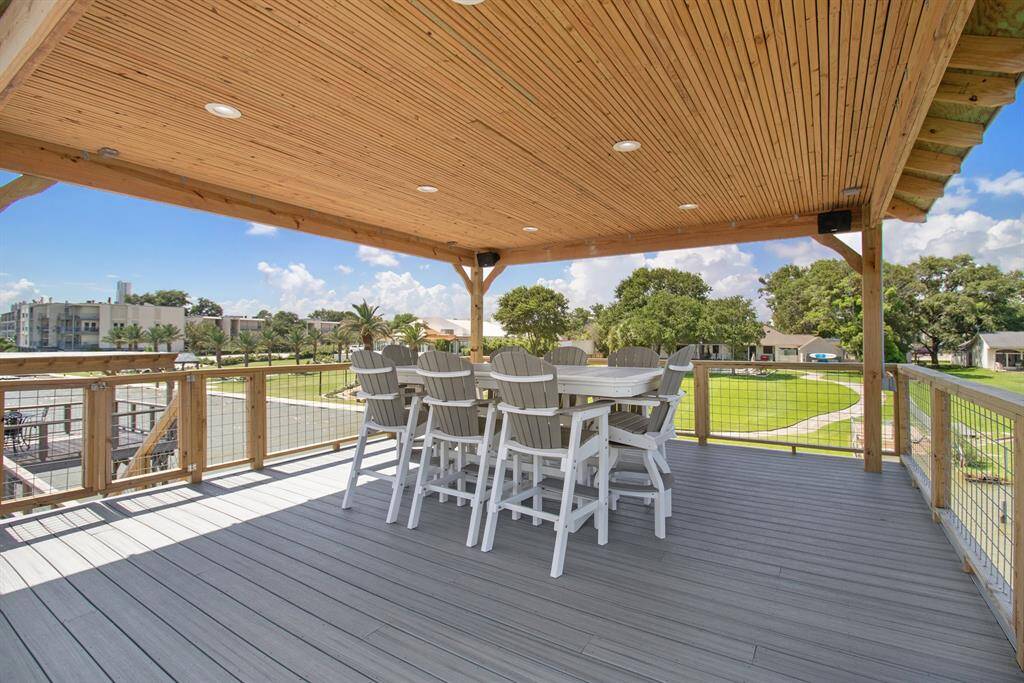 Third level sitting area fully covered with ample lighting making it the perfect place for dinner on the water with friends.