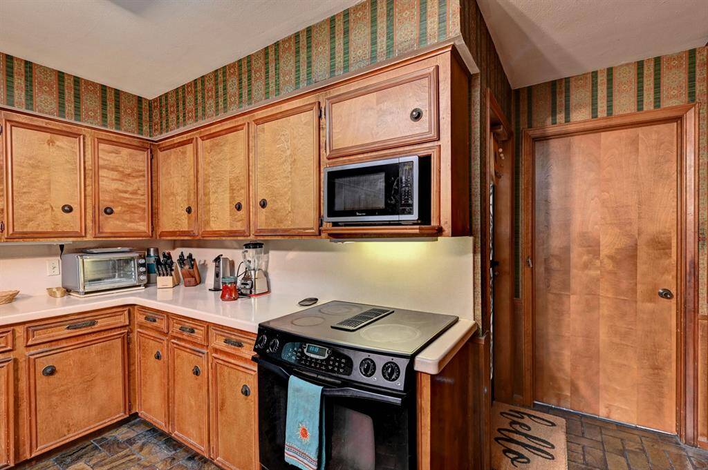 Through the door you will find the utility room. Left door goes to the garage.