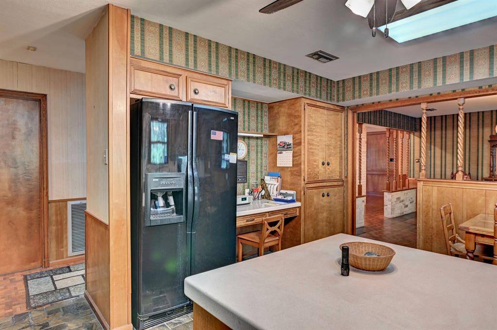 Another view of the kitchen with a built-in desk.