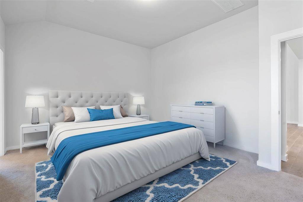 Come and unwind after a long day in this magnificent primary suite! This spacious room features plush carpet, warm paint, high ceilings, and large windows with privacy blinds.