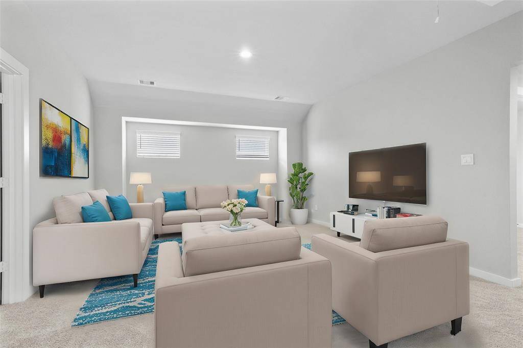 Come upstairs and enjoy a day of leisure in this fabulous game/loft room! This is the perfect hangout spot or adult game room, this space features plush carpet, high ceiling, recessed lighting, custom paint, and windows.