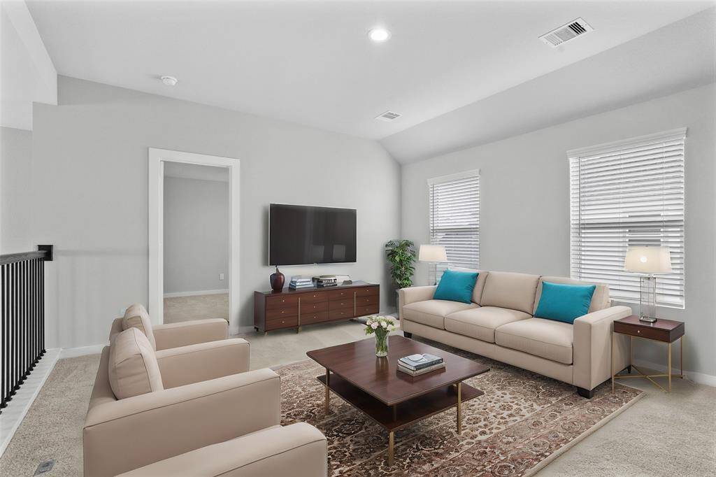 Come upstairs and enjoy a day of leisure in this fabulous game room! This is the perfect hangout spot or adult game room, this space features plush carpet, high ceiling, recessed lighting and custom paint.