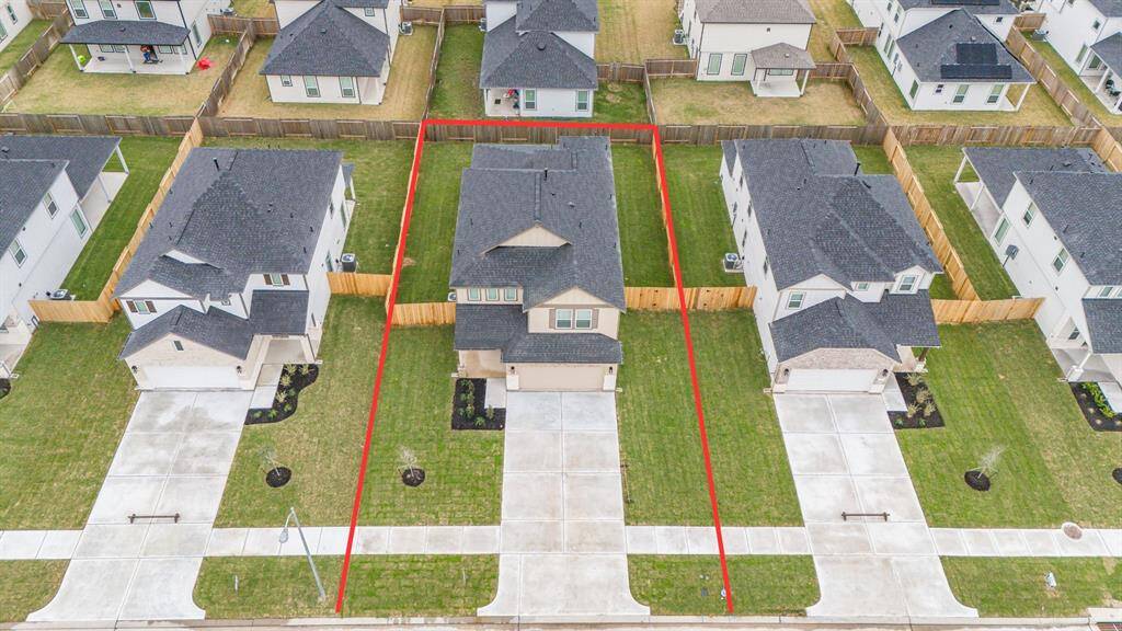 This home sits on a large lot with ample yard space in front and the back, lush landscaping and a well-maintained yard.