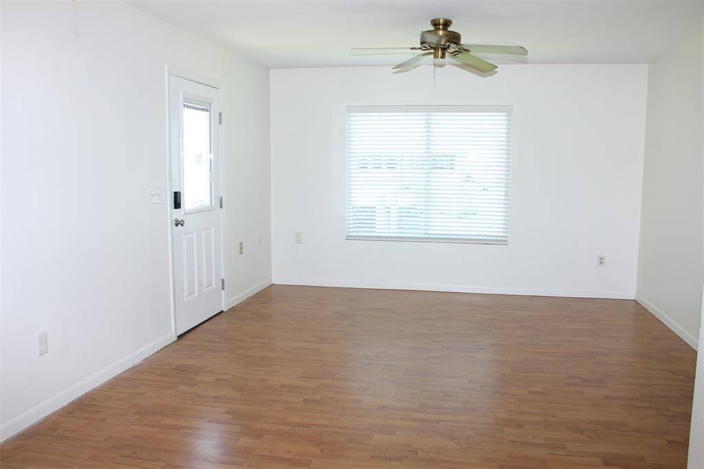 Enter into the living room with large window out to the water